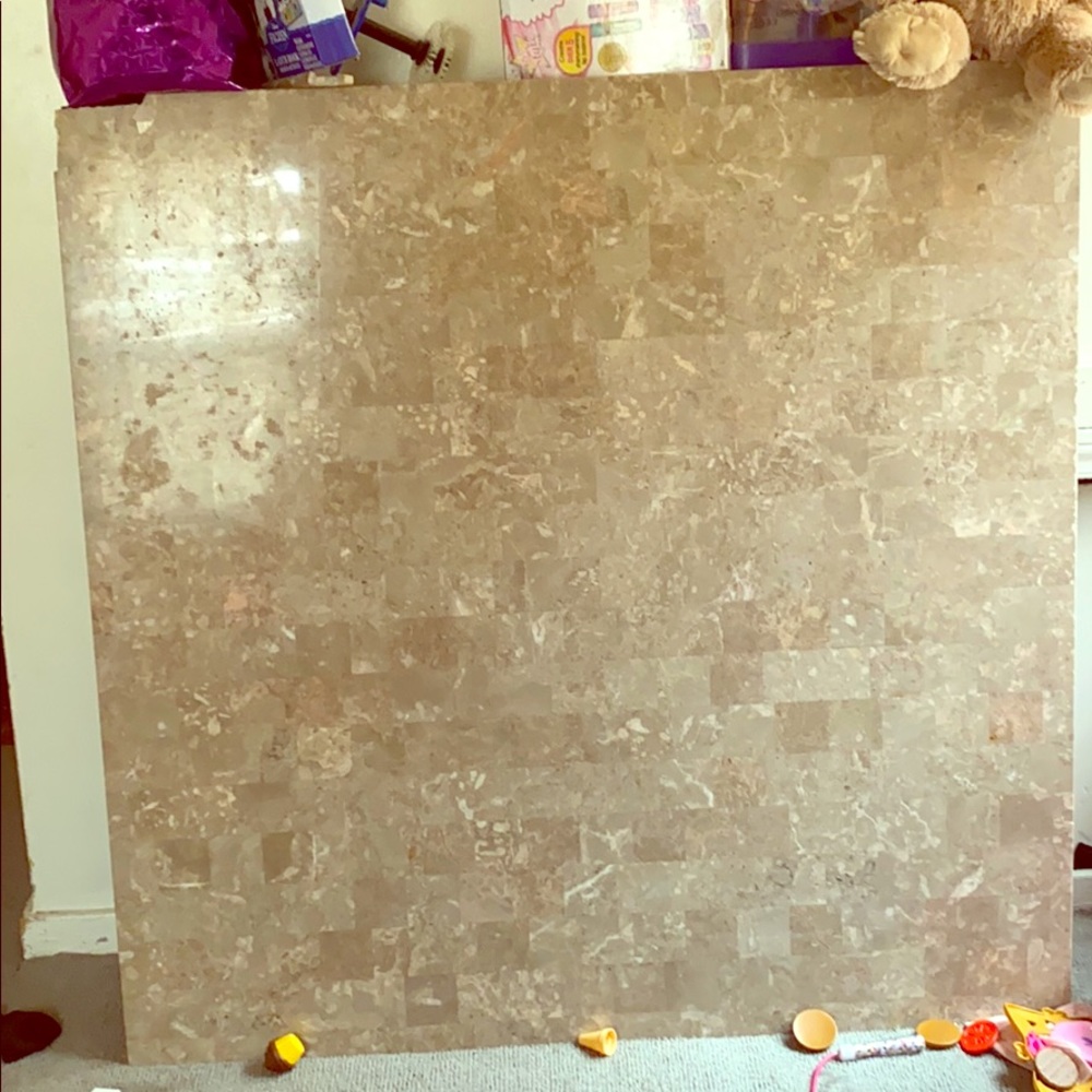 Marble tables both have a little chip n one corner